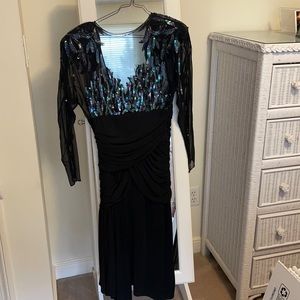 Sparkly stunning evening dress. Sexy black betting top, low back.